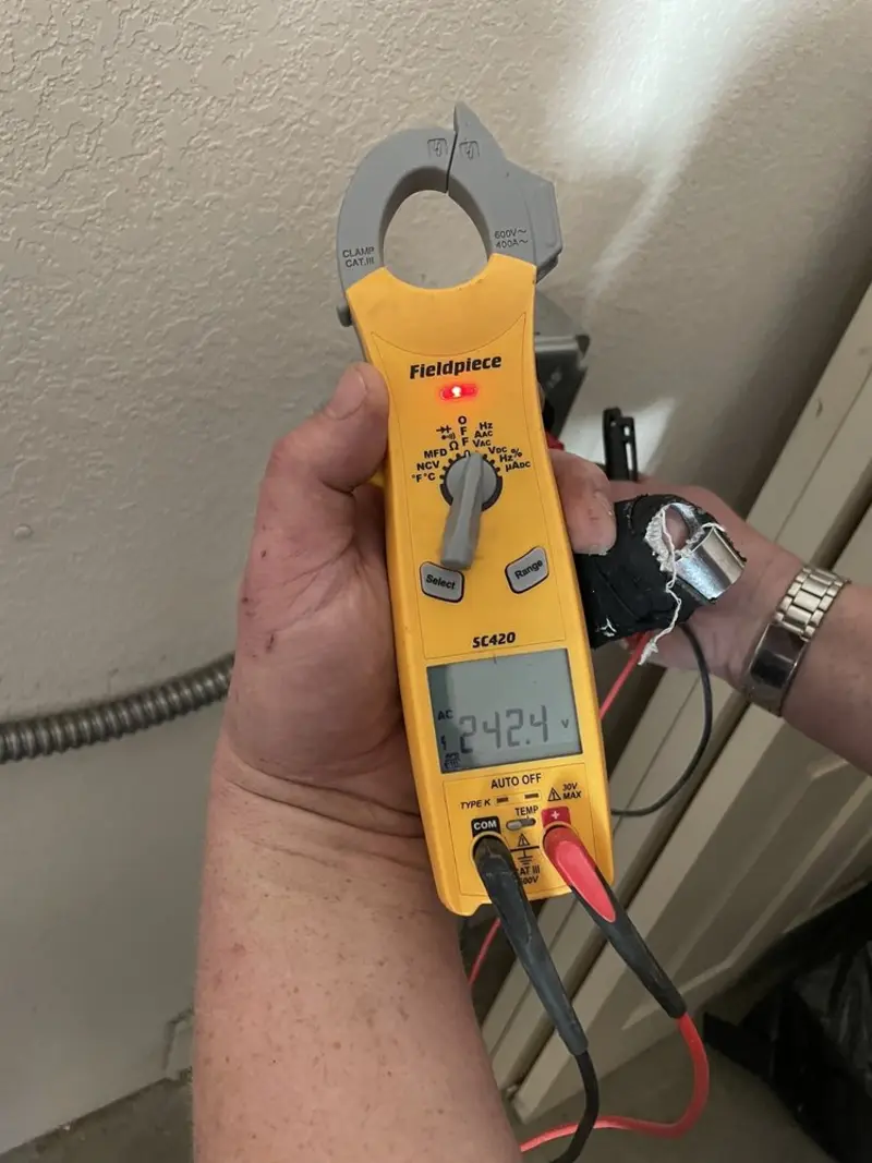 Voltage testing with clamp meter during Ceiling Fan Installation in Waldoboro